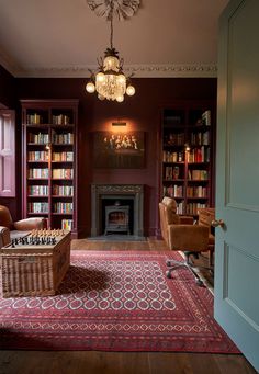 a living room filled with furniture and a fire place in the middle of a room