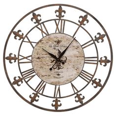 a large metal clock with fleur de lis on the face