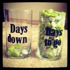 two glass vases with candy in them that say days down and days to go