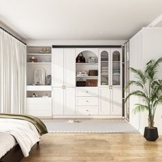 a bedroom with white walls and wooden flooring, built - in bookcases