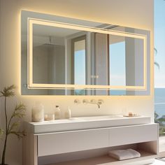 a bathroom with a large mirror above the sink