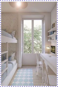 a bedroom with bunk beds and desks in front of a window that looks out onto the trees