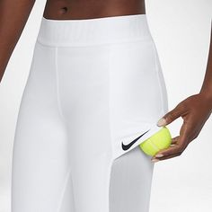 a person holding a tennis ball and a tennis racquet