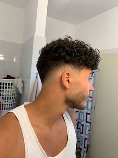 Top 17 Curly Hair Men Haircuts of 2024: Trendy Styles for a Modern Look - Get Inspired Now! Curly Hair Low Fade Men, Mens Curly Hair Fade, Man Haircut Curly Hair, Haircut Ideas For Curly Hair Men, Mens Curly Haircuts Fade, Haïr Cut For Curly Hair Men, Low Skin Fade Curly Hair, Low Fade Wavy Hair, Puerto Rican Hairstyles Men