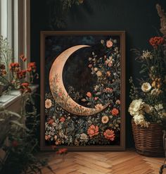 a painting with flowers and a crescent on it