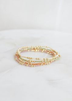 "❖Olivia Bracelet❖ * Your new favorite bracelet! Delicate and minimalistic, perfect for stacking! ‣ This listing is for a single bracelet. ‣ Buy more, save more - applied at checkout      * 3 10% off      * 5, 15% off      * 7, 20% off ‣ Olivia bracelet features: * 2mm Seed Beads * 3mm 14k Gold Filled Beads in random order * 1-5m 14k Gold Filled Bead Julisa Bracelets Feature:  ‣ Tight/Sturdy elastic, pre-stretched to prevent bracelet from stretching out ‣ Sizing according to wrist size ‣Sizing T Olivia Bracelet, Single Bracelet, Bracelets Ideas, Market Jewelry, Preppy Jewelry, Jewelry Accessories Ideas, Gold Bead Bracelets, Jewelry Essentials, Accessories Ideas