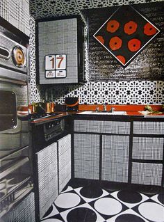 a black and white kitchen with an oven