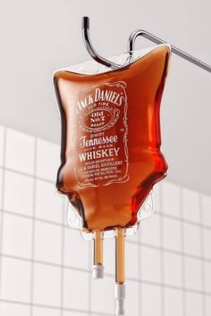 a bottle of jack daniels whiskey hanging from a hook