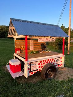 a food truck is parked in the grass