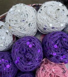 several balls of yarn with sequins on them