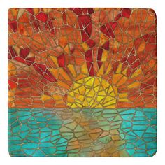 the sun is shining brightly in this stained glass tile wall art piece, which features an orange and blue background