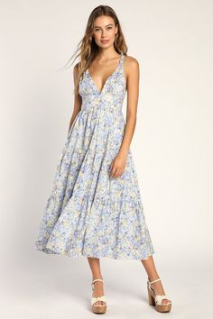 Your sweet disposition calls for a sweet dress to match, and the Lulus Brightly Blossoming Light Blue Floral Tiered Midi Dress will be a perfect fit! Lightweight woven cotton boasts a lush floral print as it shapes braided straps that support a V-neck bodice, atop a banded waist. Tiered skirt has an A-line silhouette, side pockets, and falls to a sunny midi hem. Hidden back zipper/clasp. Wedding Outfits, Light Blue Midi Dress, Sweet Disposition, Azazie Dresses, Maternity Midi Dress, Lulu Fashion, Floral Print Midi Dress, Tiered Midi Dress, Blue Midi Dress