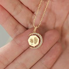 💞The Baby Handprint and Footprint Necklace is a precious keepsake, meticulously crafted in 10K/14K/18K solid gold and PT950 to capture a lifetime of memories. Available in size：16*16mm. Each piece embodies the cherished bond between parent and child. ❣Side stones: Upgradeable to diamond for a fee of $349. or upgrade to natural gemstone for a fee of $119.   Customizable with engravings on both sides, this necklace offers a truly personal touch. Whether it's your baby's actual footprints or handprints, significant dates, or names, you can personalize it to commemorate your most treasured moments. Ideal for new parents or as a heartfelt gift for loved ones, this necklace is a timeless treasure that will be cherished for years to come. Capture the essence of love and joy with this exquisite p Footprint Necklace, Moon Clock, Gift For Newborn, Baby Handprint, Necklace Moon, Baby Hands, Gold Baby, Handmade Jewelry Gift, Keepsake Jewelry