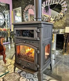 an old fashioned stove is shown in the middle of a room