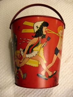 a red bucket with an image of a woman on it