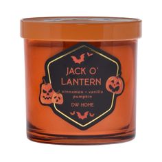 jack o'lanternen candle with pumpkins on the front and bottom, in an orange jar