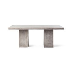 a concrete table with two legs on it