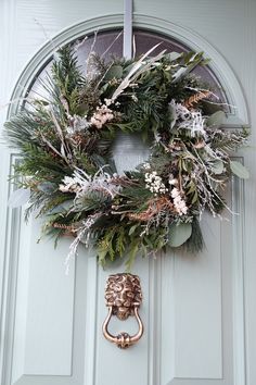 a wreath is hanging on the front door