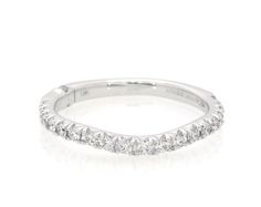 a white gold wedding band with rows of diamonds