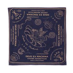 a blue bandana with an image of a bird and other symbols on it in gold foil