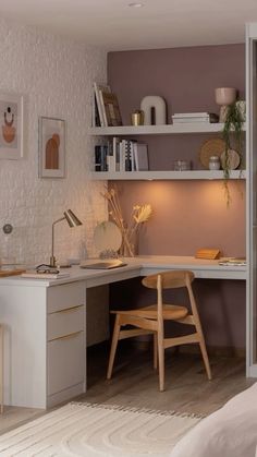 a room with a desk, chair and shelves on the wall next to a bed