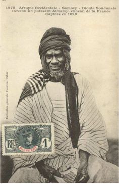 an old black and white photo of a man wearing a turban with a dog in his lap