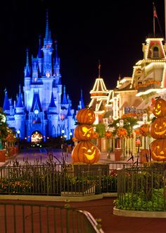 halloween decorations are displayed in front of the castle at disneyland's magic kingdom park