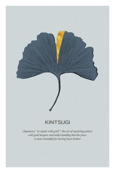 a blue and yellow leaf with the words kintsugi written in gold on it