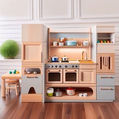 a toy kitchen with wooden floors and white walls