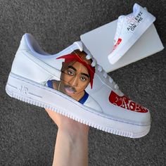 Custom Air Force 1 including a portrait of Tupac, his cross tattoo "Exodus 1831" and a bandana pattern. * handpainted in Germany * unique and individual manufacturing * waterproof & scratch resistant * 1-2 weeks processing time INDIVIDUAL DESIGN Customizations or a completely own design? Text to me here or on Instagram (@annamarie_diy) ♥︎ Your dream shoes with: * Colors: Normal, Metallic, Neon, Glow in the Dark, Colorshifting, Sunlight sensitive * Glitter, rhinestones (e.g. Swarovski) * Engraved Custom Air Force 1 Design, Tupac Design, 2pac Shakur, Painted Nikes, Custom Jordans, All Eyez On Me, Shoes Diy, Unique Sneakers, Custom Air Force 1