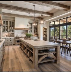 a large kitchen with an island in the middle