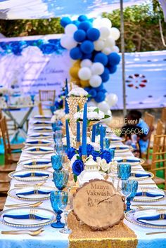 a long table with blue and white decorations