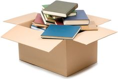 an open cardboard box with several books in it