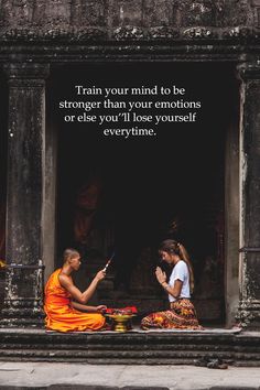 two women sitting on the steps in front of an old building with a quote from buddha