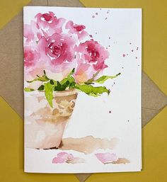 a watercolor painting of pink flowers in a vase on a yellow background with brown envelope