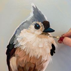 a painting of a bird is being painted