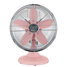 the pink fan is sitting on top of a white base and it's blades are pointing upward