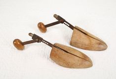 This listing is for a pair of very old #4 matching right and left wooden shoe trees.  They are in good condition, with lots of character.   Even though there is surface rust on the metal pieces they still work as they should. Size:  adjusts from 3 to 3-1/2" wide and 10-1/2 to 13" long They don't make things of quality like this anymore.  Use as it was intended or as a decorative piece in your home.   Because this is a used vintage item please look at the photos carefully and any question you may Shoe Stretcher, Adjustable Shoes, Vintage Shoe, Wooden Shoe, Wood Shoes, Wooden Shoes, Decoration Piece, Shoe Tree, Shoe Insoles