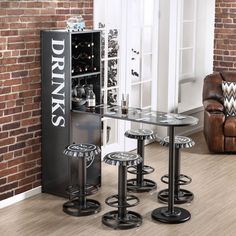 three stools and a table in front of a brick wall with a wine cooler