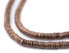 three strands of brown wood beads on a white background