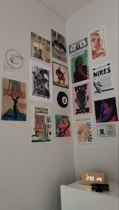 there are many different posters on the wall