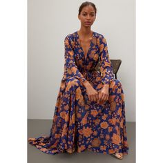 Blue floral chiffon (97% Polyester, 3% Metallic). A-line. Long sleeves. V-neck. Pull on. 58" from shoulder to hemline. Made in the USA of imported fabric. Chic Flowy V-neck Dress With Floral Print, Flowy V-neck Floral Dress For Fall, Printed Chiffon V-neck Maxi Dress, V-neck Chiffon Maxi Dress With Print, Chic Flowy V-neck Floral Dress, Flowy Floral Print V-neck Dress For Party, Spring V-neck Flowy Chiffon Dress, Elegant Flowy V-neck Dress With Floral Print, Blue Flowy A-line Chiffon Dress