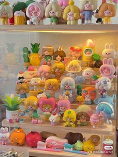 there are many small toys on the shelves