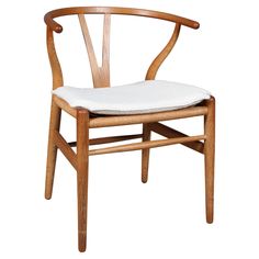 a wooden chair with a white seat cushion