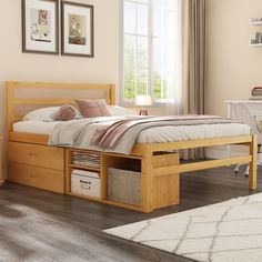 a bed with drawers underneath it in a room