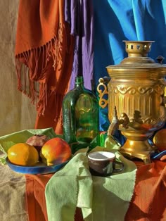 a table topped with a bowl of fruit next to a tea pot and other items