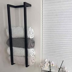 a towel rack is hanging on the wall