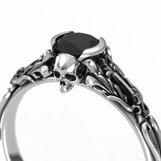 "To see my collection of Skull themed rings, click here: https://www.etsy.com/shop/MetalWendler?ref=seller-platform-mcnav&search_query=skull To see THIS ring style with a 6.5mm center stone option, click here: https://www.etsy.com/listing/727618858/skull-engagement-ring-white-gold-with Beautifully crafted Edwardian vintage style filigree skull engagement ring. Actual ring may vary slightly as they are finished by hand, but final rings are very, very close to what you see in the images. See m Engagement Rings With Black Diamonds, Classic Skull Ring For Anniversary, Black Engraved Ring With Intricate Design, Elegant Skull Ring As Gift, Gothic Engraved Rings For Anniversary, Gothic Anniversary Rings, Formal White Gold Skull Ring, Elegant Skull Ring For Anniversary, Black Skull Jewelry For Anniversary