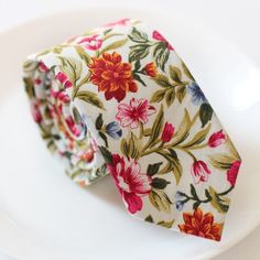 two floral ties on a white plate