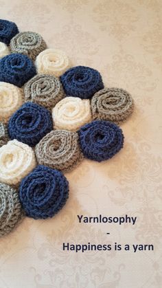 there are many crocheted flowers arranged in the shape of a star on top of a table